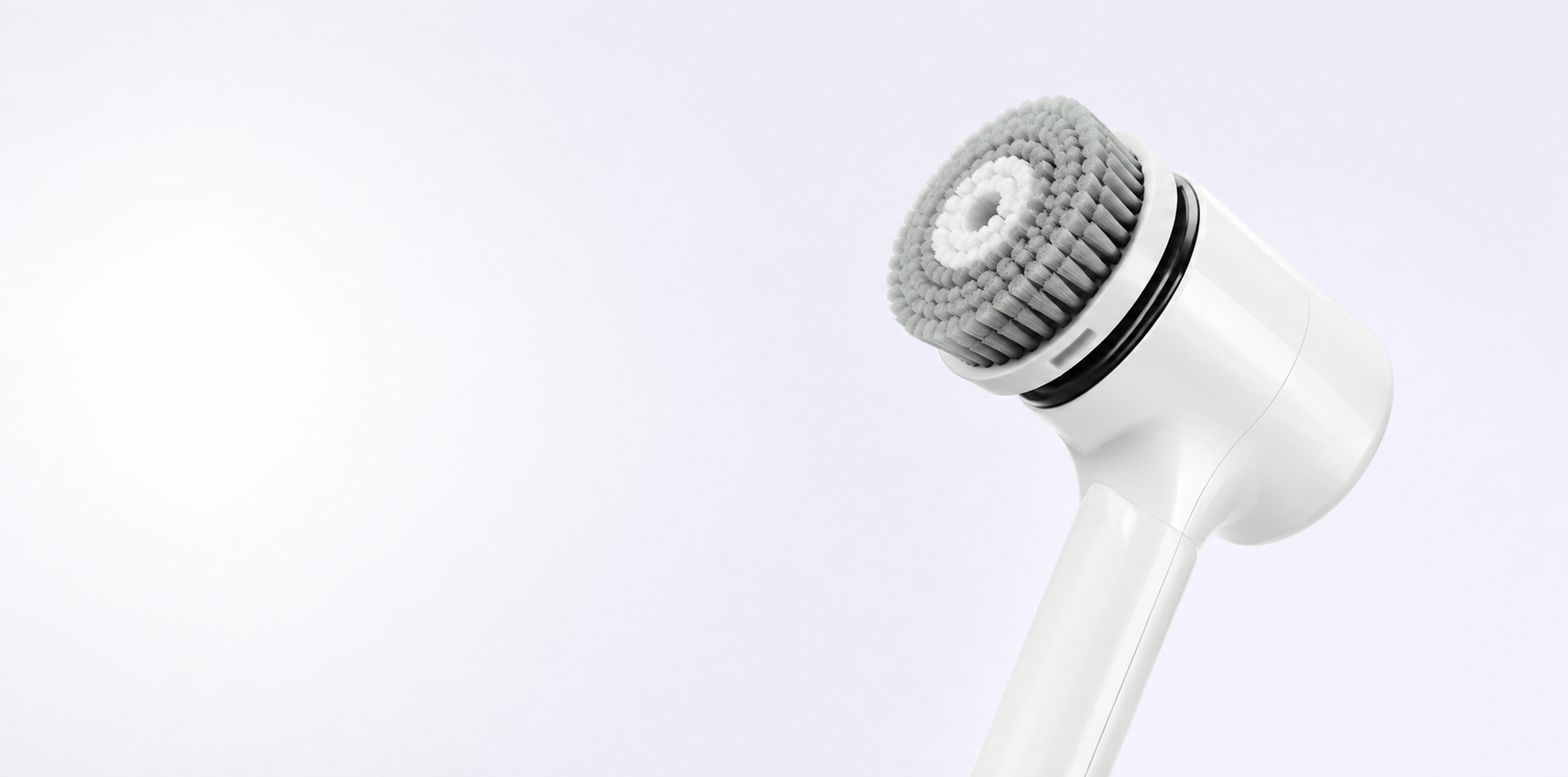 SparklePod scrubber with brush head on a soft lavender background